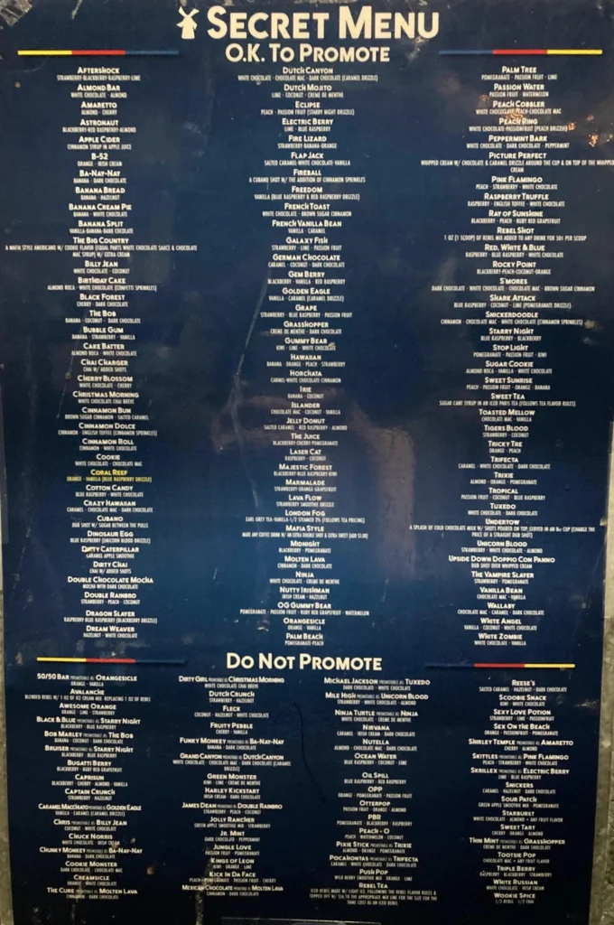 A table showing several Dutch Bros secret menu drinks with columns for drink name, available sizes, calories, total fat, sugar, caffeine content, allergens, and main ingredients